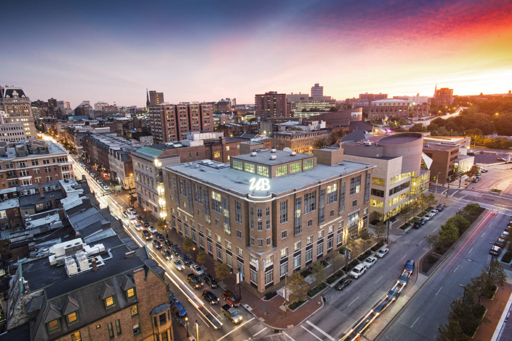 Skyline of Midtown Baltimore focused on University of Baltimore Thummel Business Center at dusk.